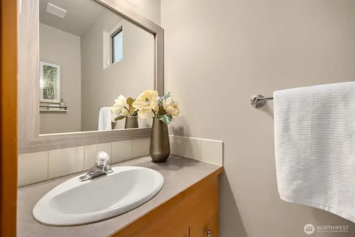 A powder bath on the main level is conveniently tucked away at the back of the townhome.