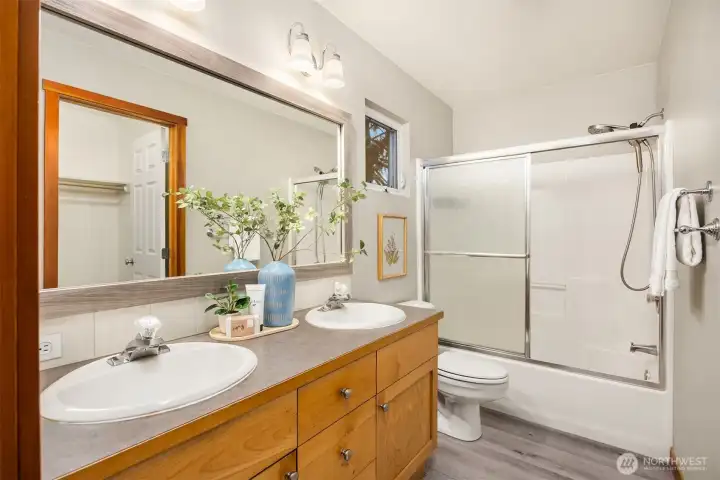 The primary bath features a double vanity with ample counter space and great storage space.