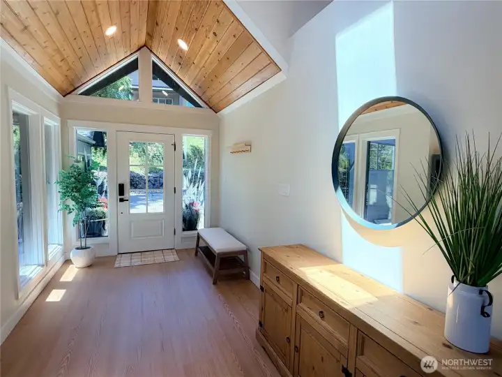 Step inside to a soaring vaulted entryway with a gorgeous wood ceiling, warm luxury floors, and an abundance of natural light. This is the welcome home you have been waiting for.