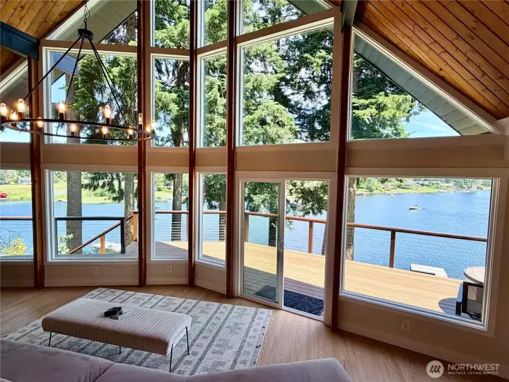 This wall of windows is one of many reasons people fall in love with this home. The entire A-frame glass facade opens the living room directly to Lake Meridian, with the composite deck and flat lakeside yard just beyond. Motorized boating, kayaking, and the Lake Meridian 4th of July fireworks show are all right here.