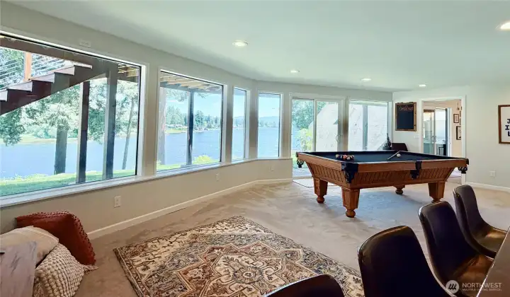 The daylight basement great room wraps you in lake views from a sweeping curved wall of windows. With a separate entrance and its own full kitchen, this space is the ultimate flex space, MIL suite, entertainment hub, or income-producing rental. No HOA means short-term rentals are permitted.