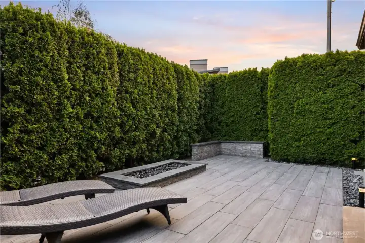 Private, hardscaped backyard for easy maintenance Private, hardscaped backyard for easy maintenance