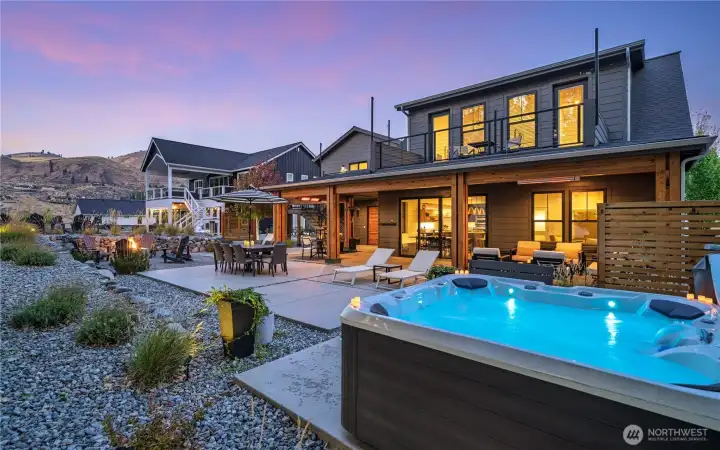 View of outdoor living area with private hot tub.
