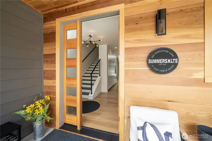 Front door ADA-friendly entryway and front door with cedar soffits and detailing.