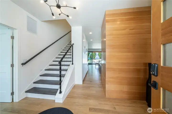 Main level entryway with stairs leading to the upper level with two king ensuite bedrooms.