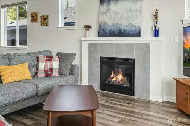 The gas fireplace adds lovely ambiance to the spacious living room.