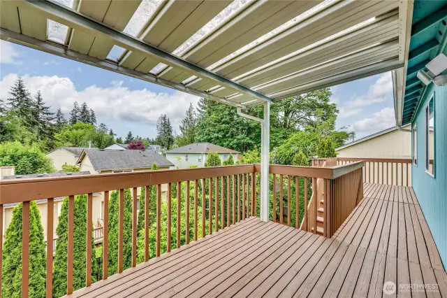 Covered back deck is huge and wonderful for entertaining.