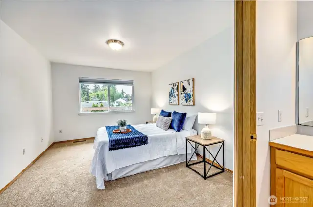 Primary suite with ensuite bath and walk-in closet.