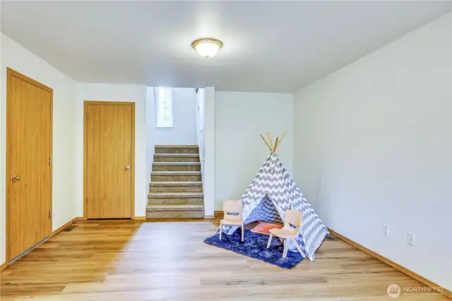 Downstairs family room. There is also a bedroom, full bath and laundry on this level