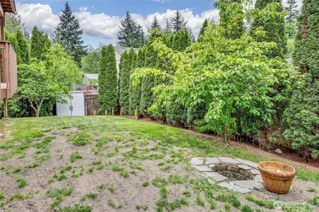 Fruit trees and fire pit.