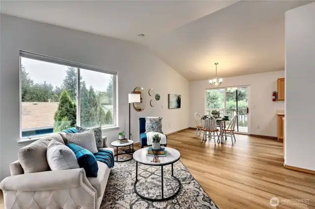 Large living room (there is a living room on each level) with vaulted ceilings and new LVP floors!