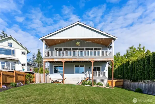 Back view of the house from the yard looking up at your huge back deck!