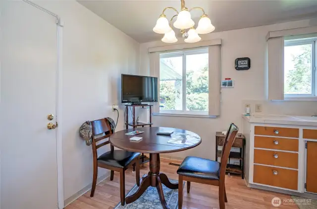 The dining area sits just off the kitchen and features direct access to the garage—perfect for everyday convenience.