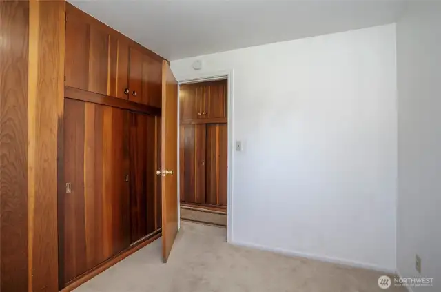 First guest suite offers a built-in closet along with extra storage for added convenience.