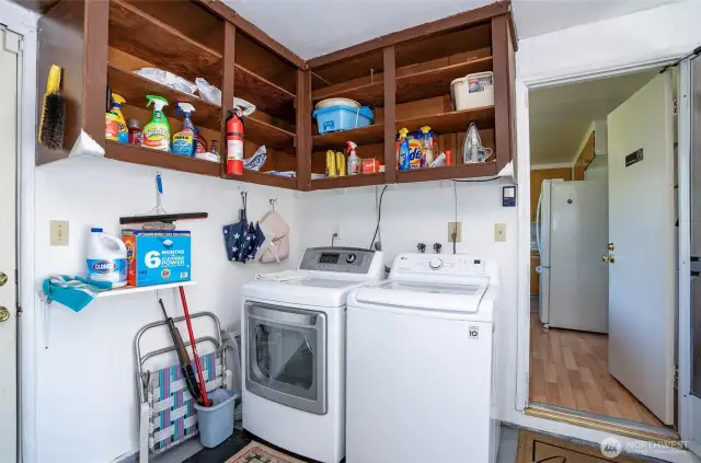 The utility room is located in the garage, offering convenient access into the home. Ample cabinet space provides great storage for everyday essentials.