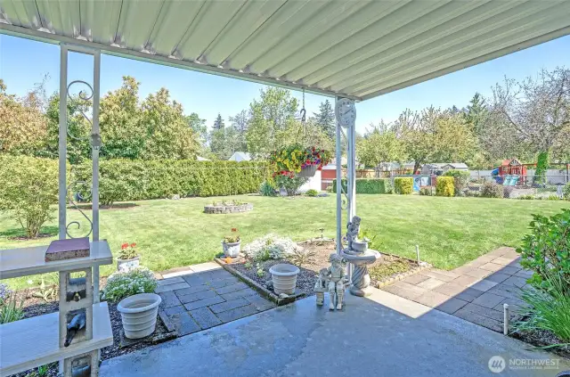A covered patio creates the perfect spot to unwind and enjoy the outdoors.