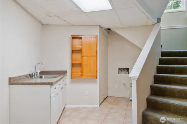 Utility room and 2nd stairway to upper level