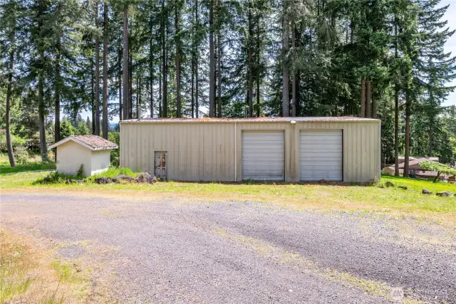 Shop with horse stalls, overhead doors and RV Parking in Back