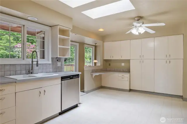 Built in Pantry storage, Skylights and slider to entertaining deck