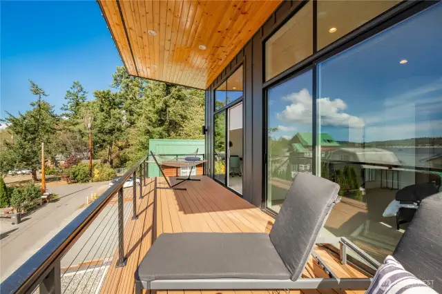 Patio on upper floor extends off guest and primary bedrooms.