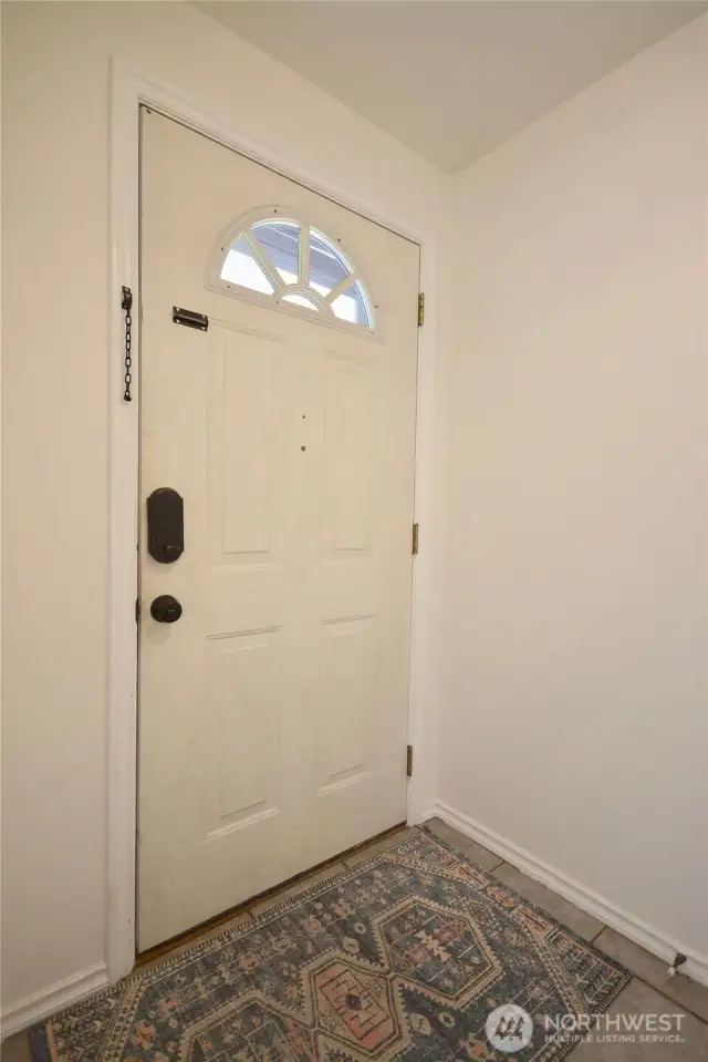 Entry to Foyer with storage closet