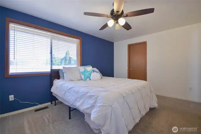 Primary bedroom light and bright with walk in closet and bath off master. 11 x 13 very nice size.