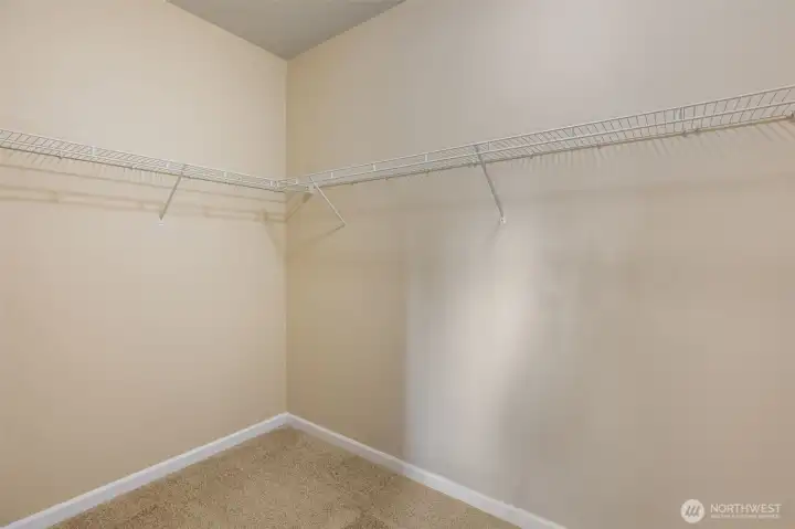 Upstairs primary walk-in closet