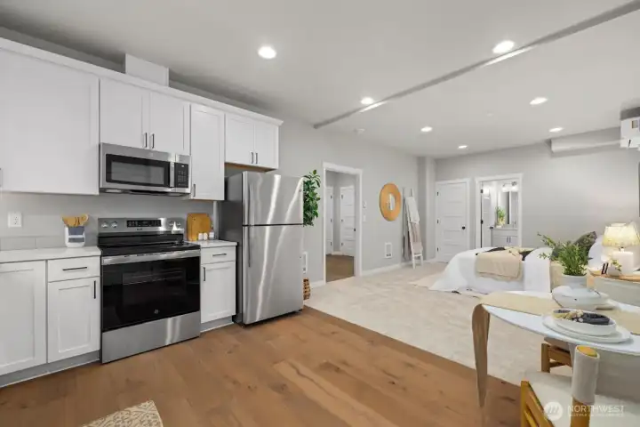 Lower level studio suite/ADU with full kitchen, full bath, and private entrance.