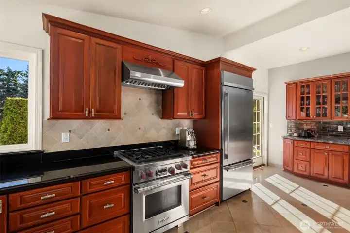 This is a chef's kitchen with top-of-the-line appliances making cooking a breeze.
