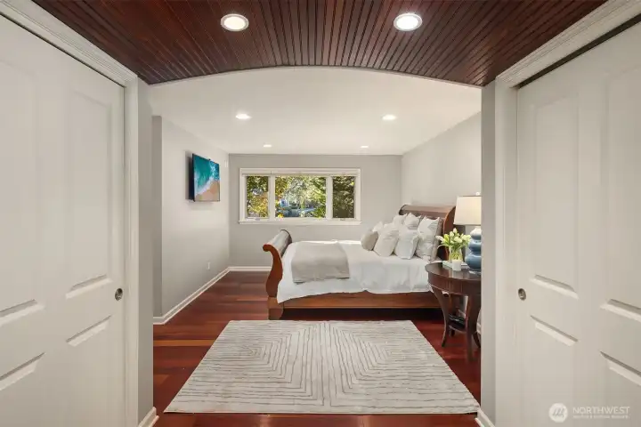 The primary suite is tucked thoughtfully on the main floor, delivering the ease and privacy of single-level living when you want it.