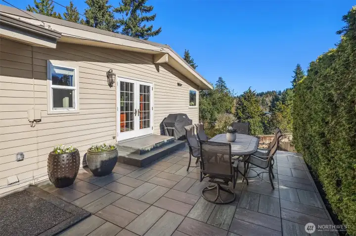 Step outside to a generous deck or a separate dining patio, and the home extends beautifully into the outdoors.