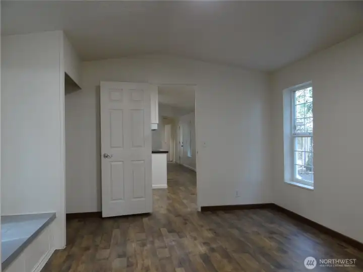 Primary Bedroom With Two Full-sized Closets. Looking back to Living Room Area.