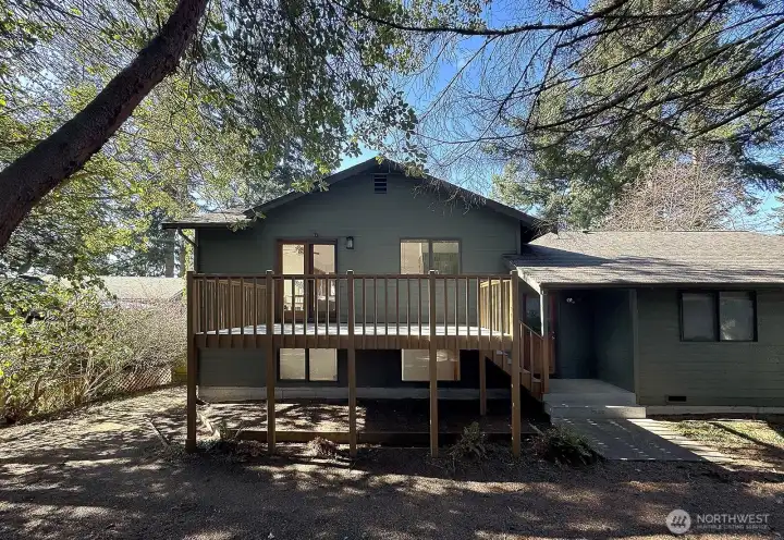 There is another deck on the rear of the house and the exterior door on the main level leads into the Laundry Room.
