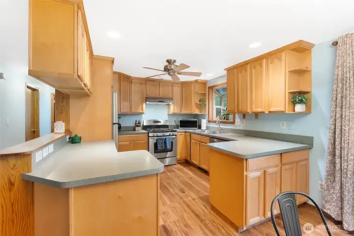 Wonderful kitchen with lots of cabinet and countertop space.