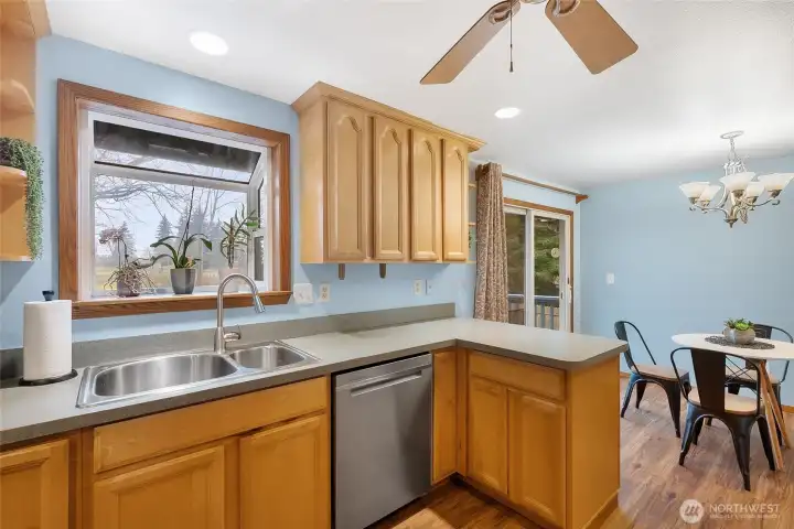 Great window above the sink overlooking the large back yard and beautiful tree farm.