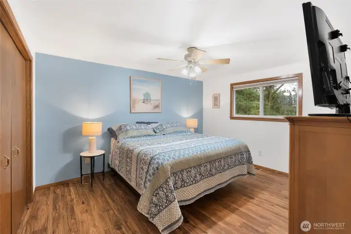 Primary bedroom with views to the private back yard