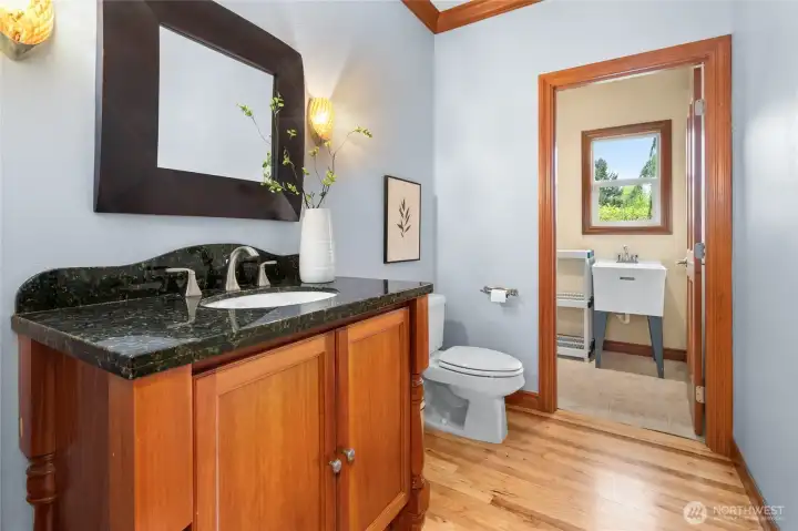 Elegant powder room and practical mudroom.