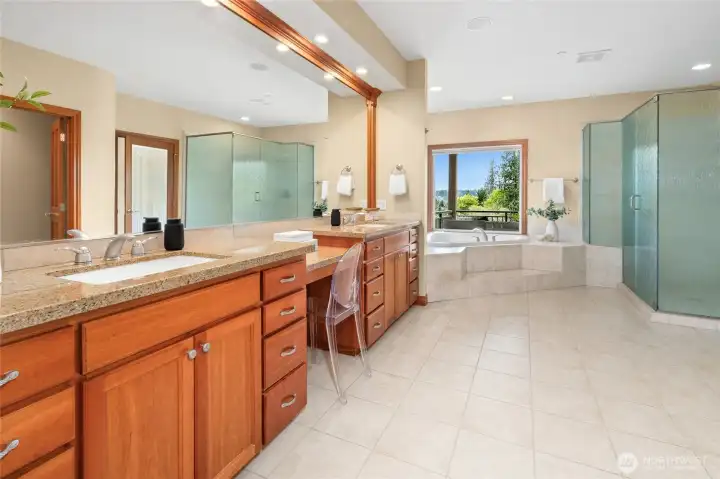Waterfall glass, private corner soaking tub. Who needs the spa?