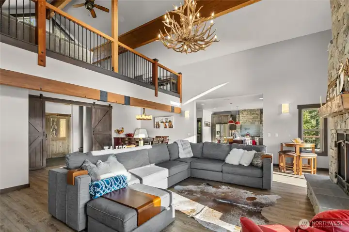 The custom barn doors allow you to separate your main floor living from the stairs which lead you to the upper massive loft or downstairs living area
