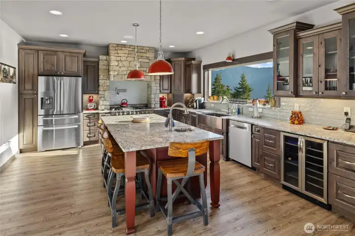 Another view of this spectacular kitchen, complete with wine frig, under counter lighting and so much room. Easy to have others help out in the kitchen when it is this size.