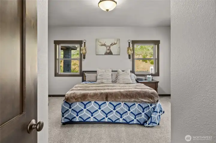 A main floor bedroom with its own private bath is conveniently offered just past the kitchen area.
