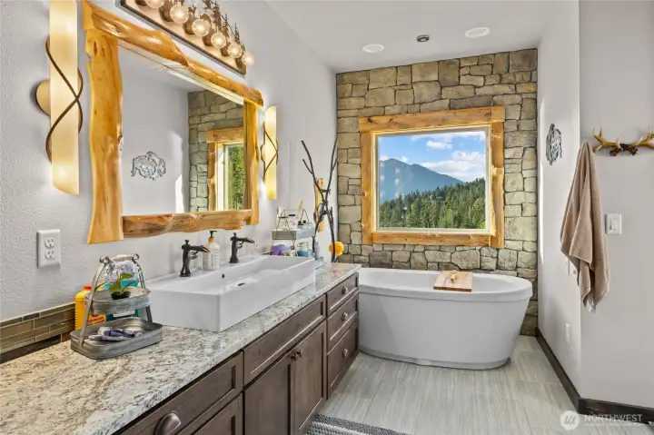 Primary bathroom. No detail spared here. Custom cabinets, mirrors, trim work and plumbing.