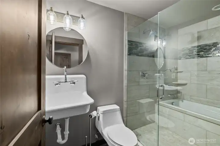 Stunning full lower level bathroom.
