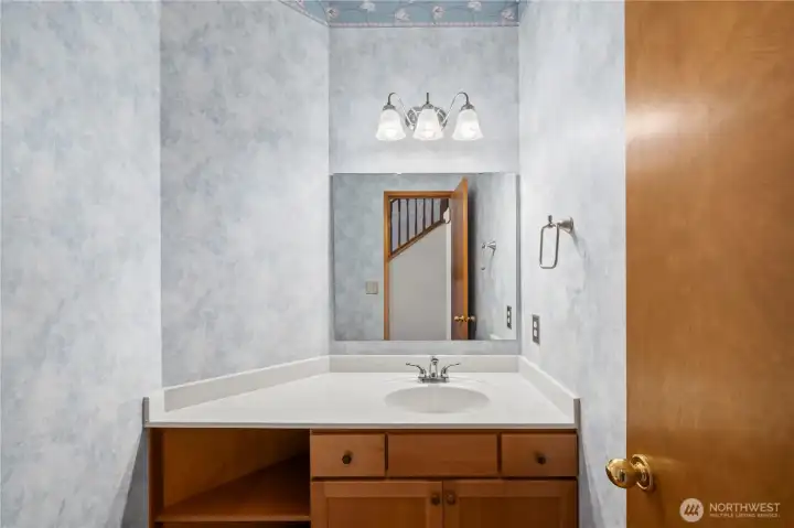 Convenient downstairs half bath for guests and everyday use