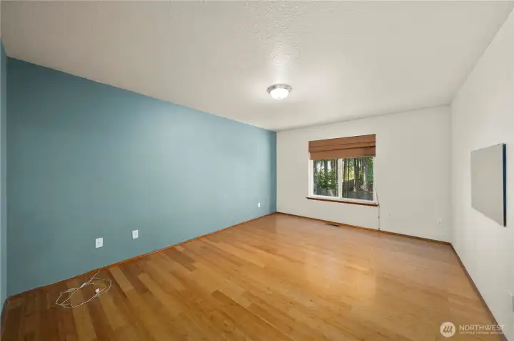 Primary bedroom with backyard views and plenty of space for a full furniture setup