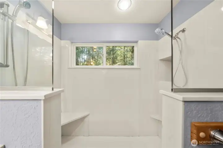 Oversized walk-in shower with built-in seating