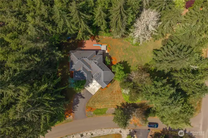 Private, tree-lined setting with spacious lot and peaceful natural surroundings