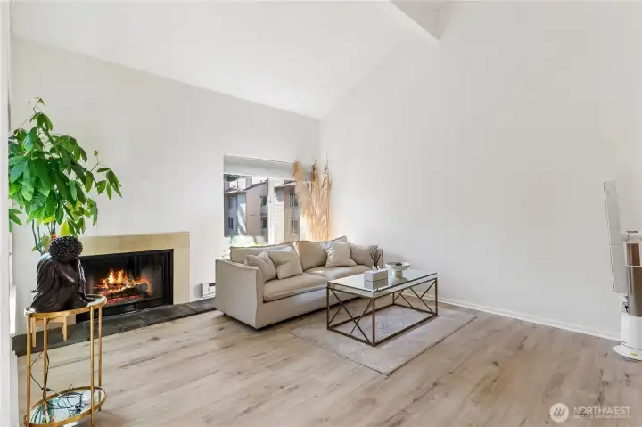 The large vaulted living room also has a wood burning fireplace for those warm cozy winter nights. The large vaulted living room also has a wood burning fireplace for those warm cozy winter nights.