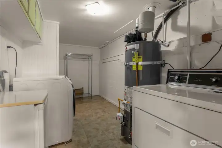 Laundry and storage room (no photo) with plenty of space to enlarge the bathroom.