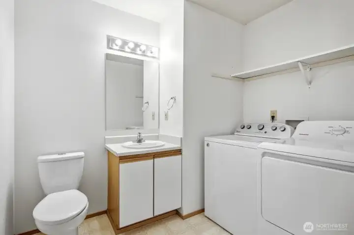1/2 Bath main floor with laundry. 1/2 Bath main floor with laundry.